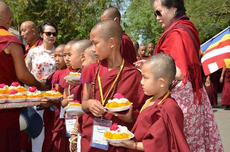 Waiting with flower offerings.